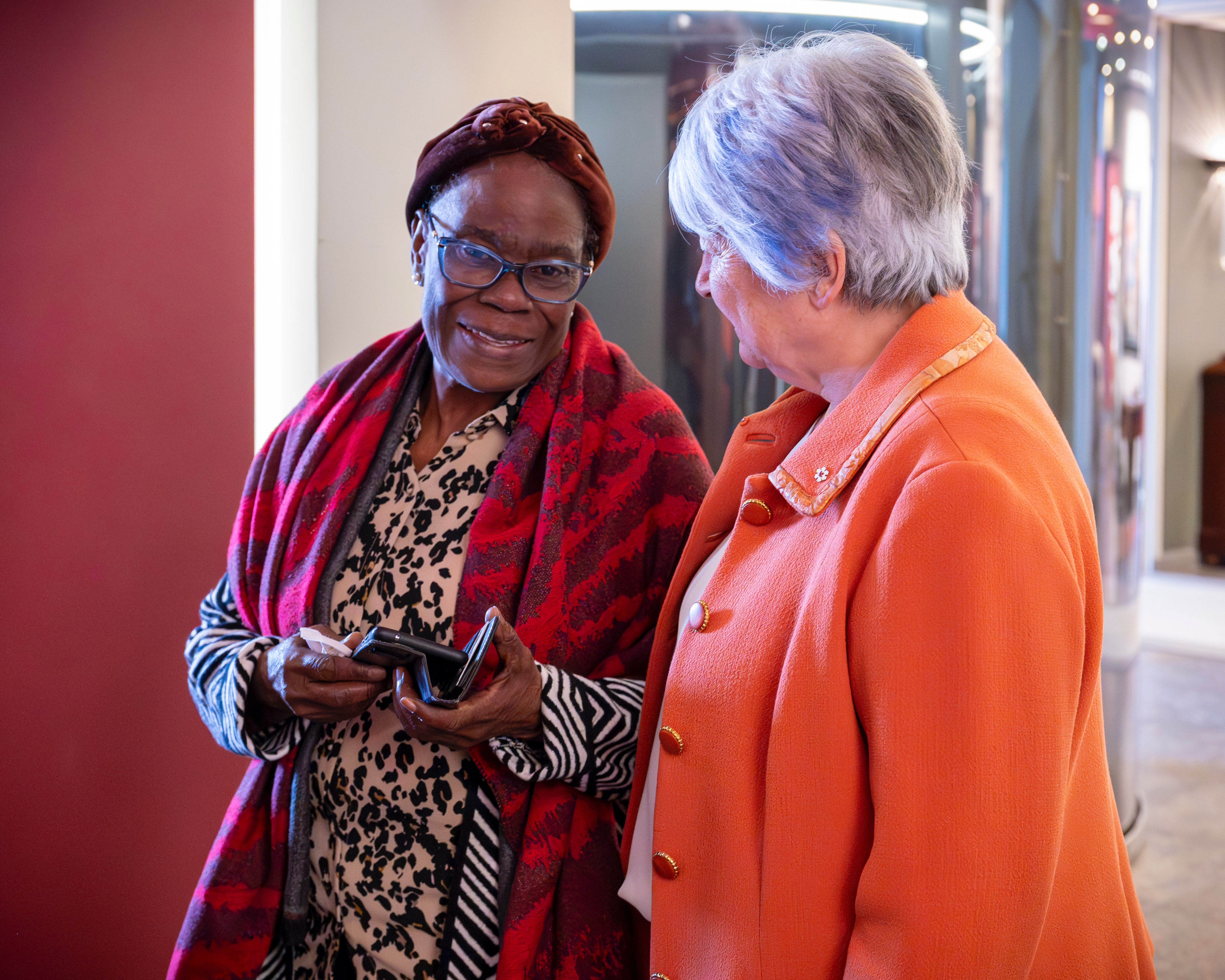 Governor General talking to a person. They are both smiling.