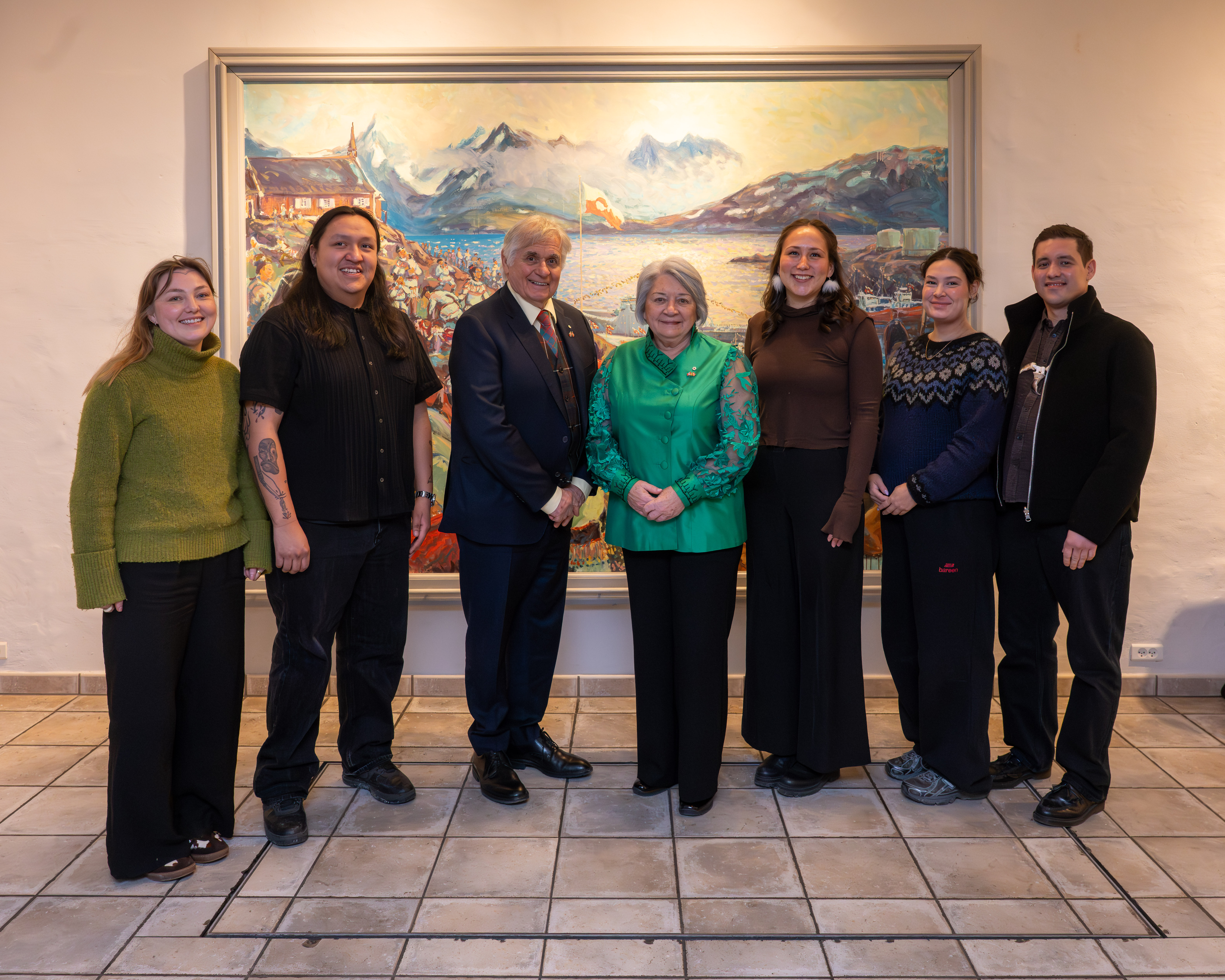 Governor General Mary Simon and Mr. Whit Fraser standing with youth from Avalak, the national Greenlandic student organization in Denmark