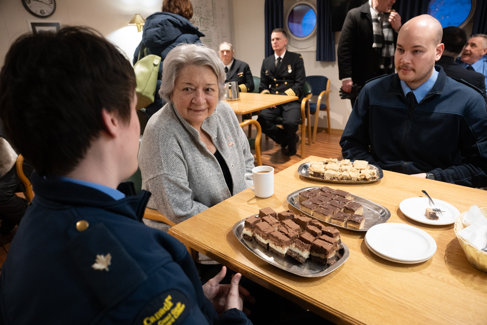The Governor General seated with crew members onboard the CCGS Jean Goodwill.