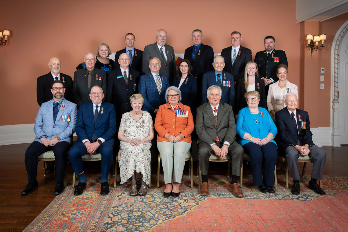 Governor General Mary Simon and Mr. Whit Fraser with Sovereign Medal for Volunteers recipients.