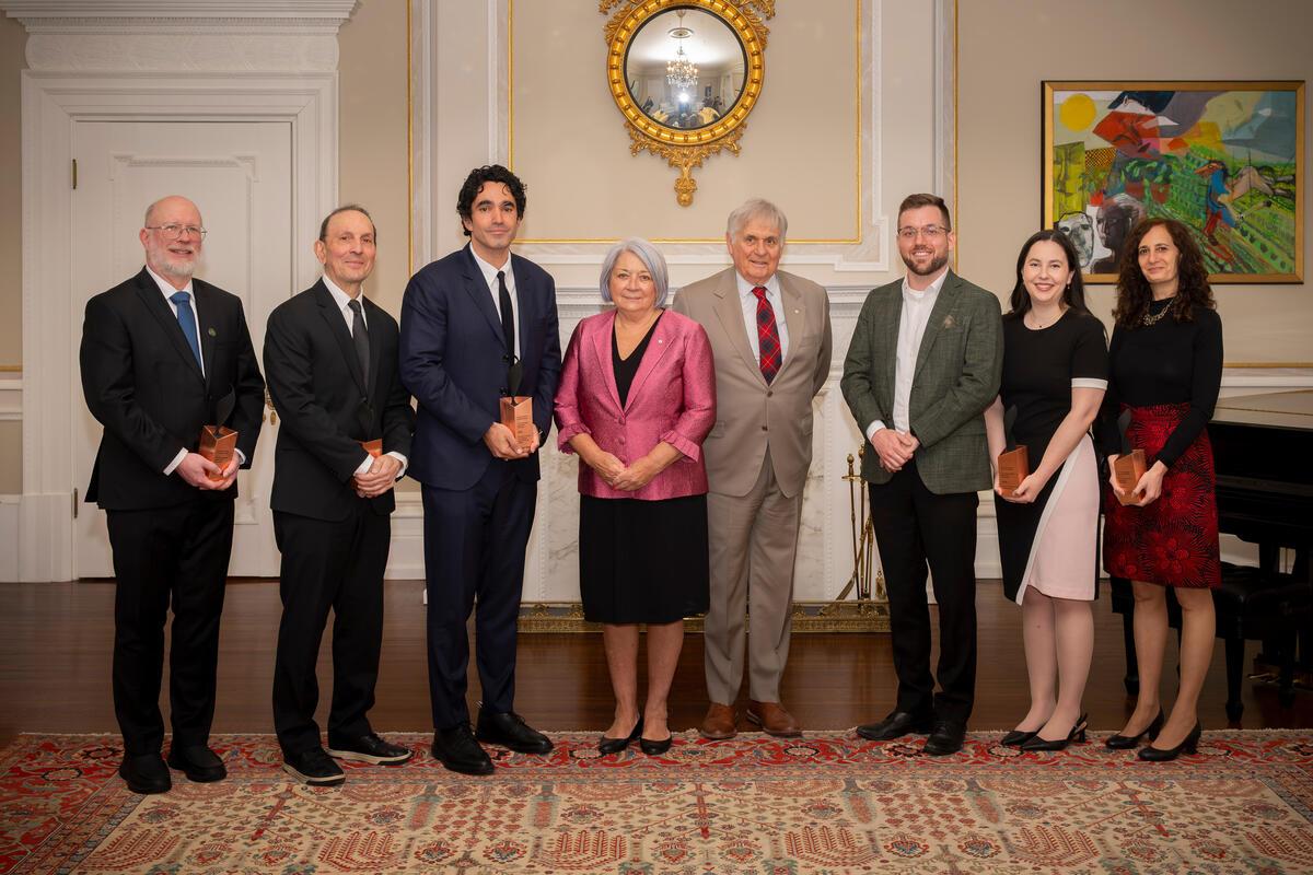 Governor General Mary Simon and Mr. Whit Fraser standing with six Governor General Innovation Award recipients.