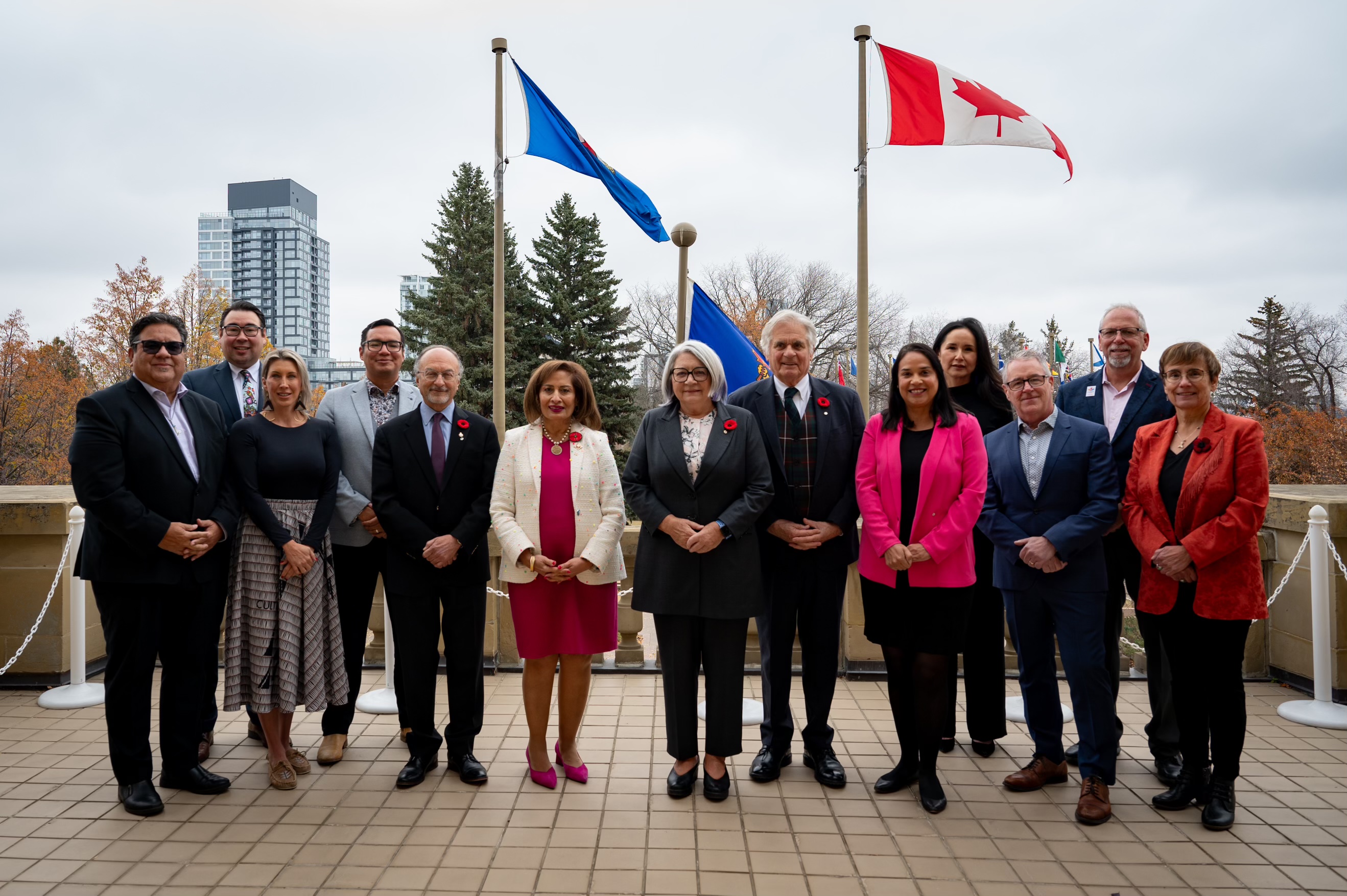 Governor General Mary Simon and Mr. Whit Simon stand among a group of people.