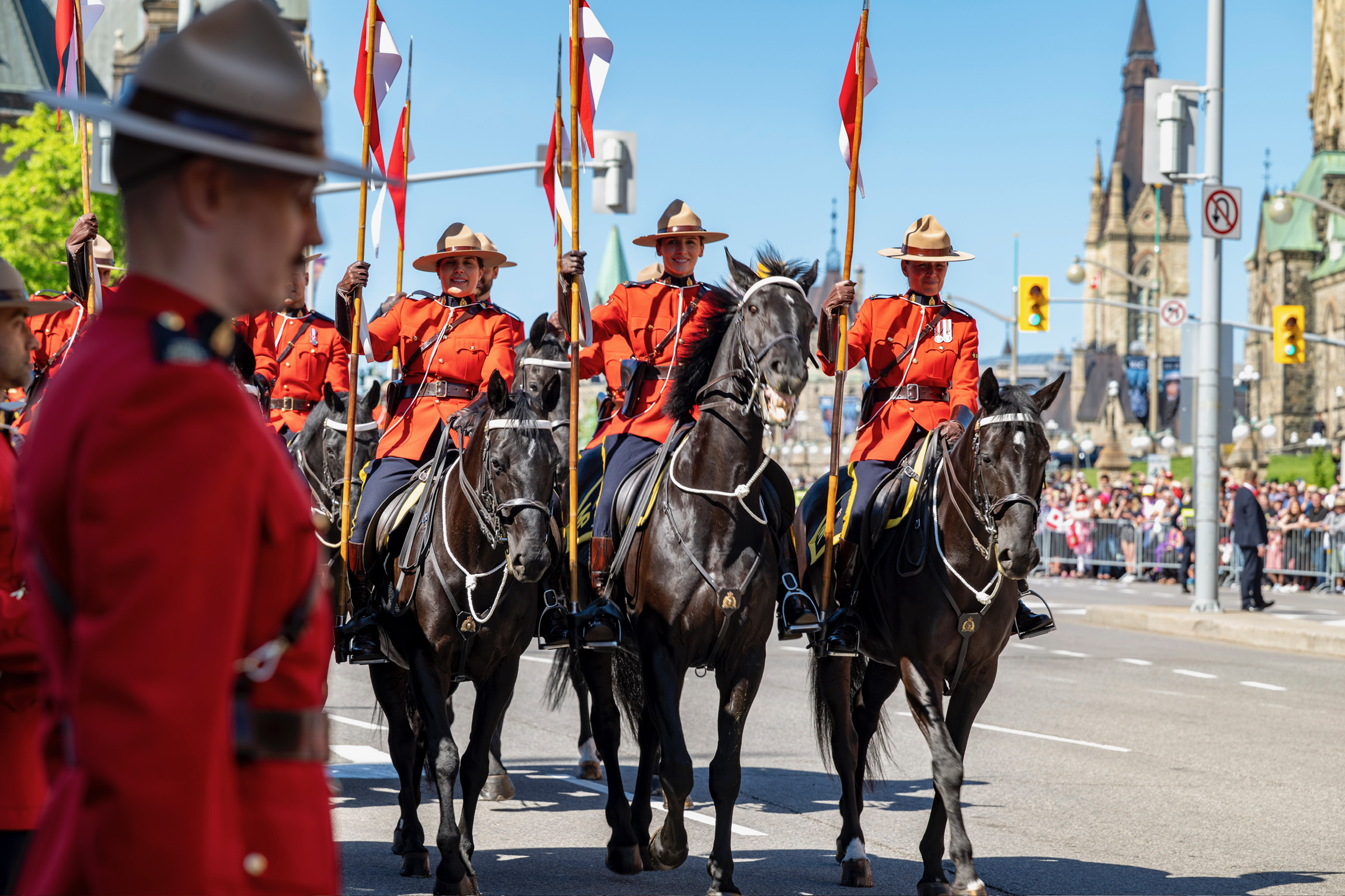 RCMP horse leading parade ahead of Their Majesties.