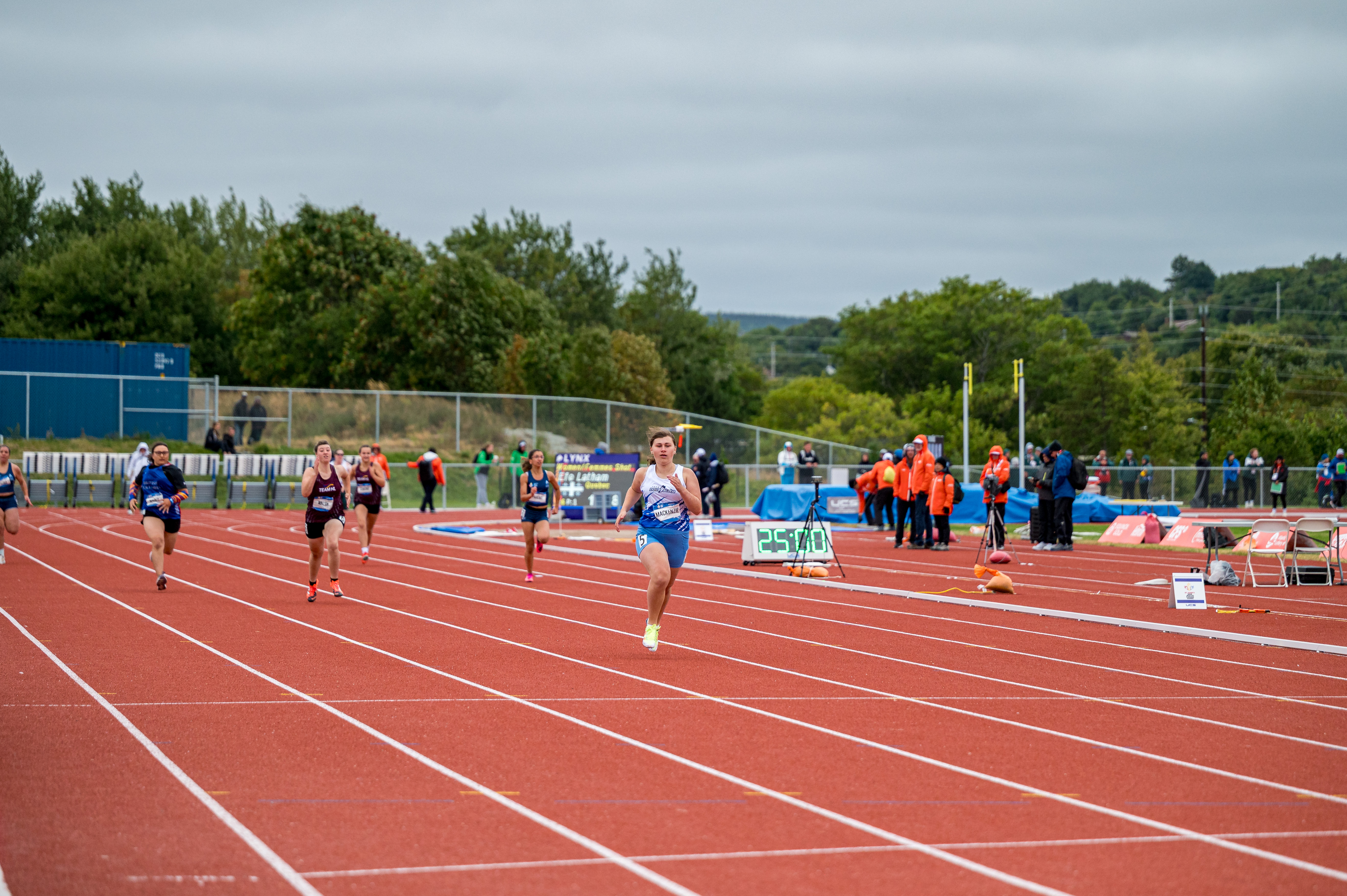 Athletes running a race on a track.