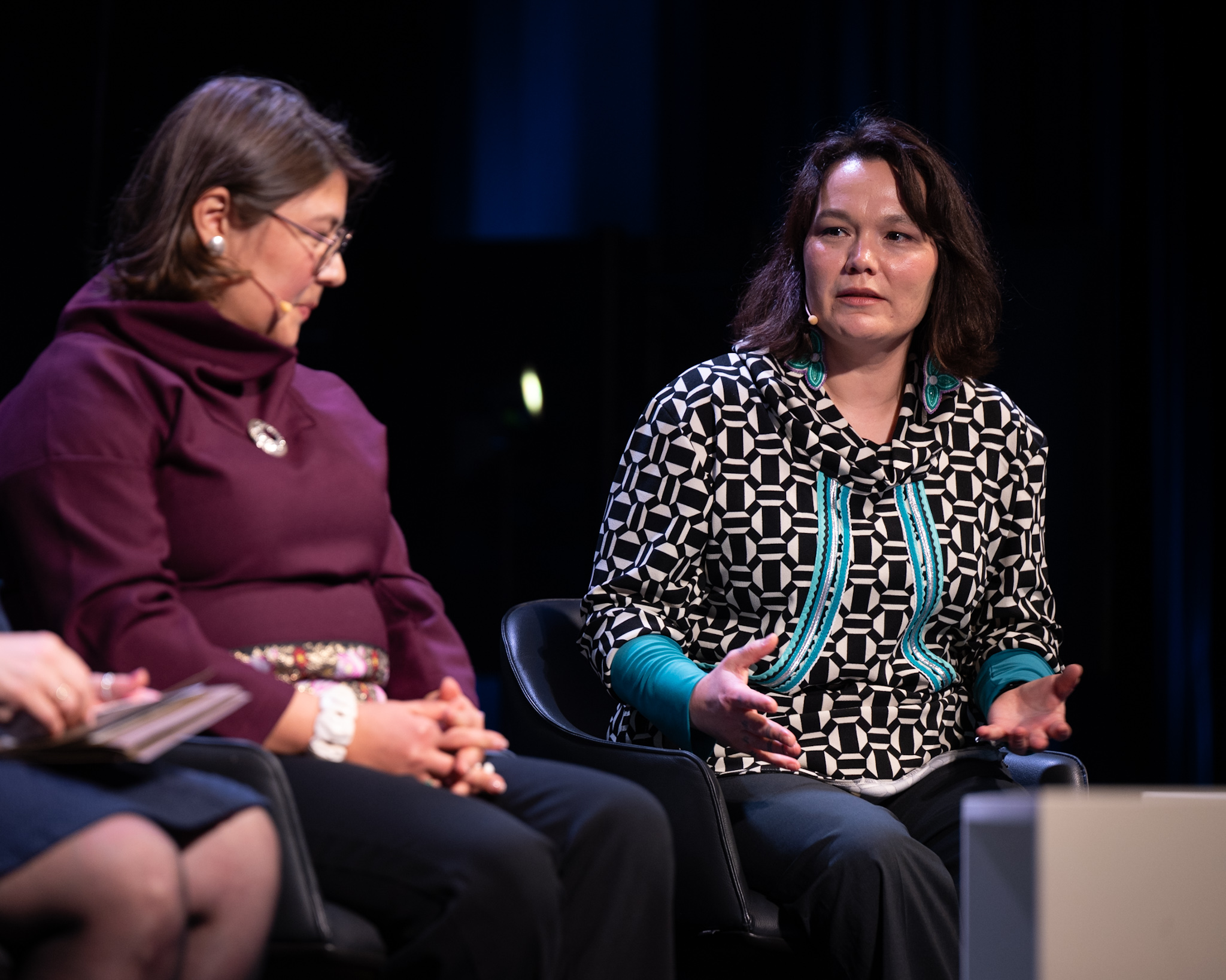People on stage having a discussion.