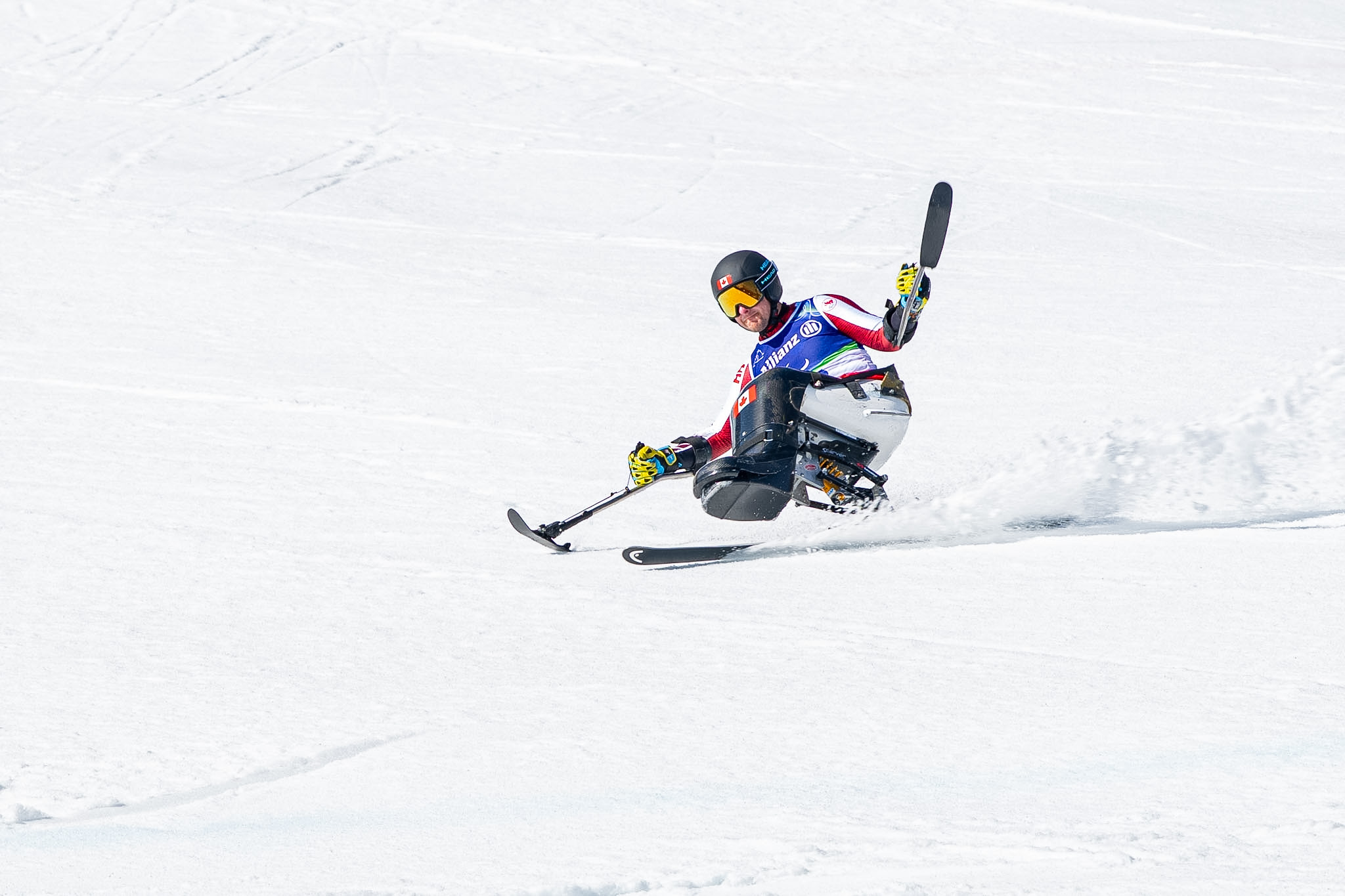 A Paralympian participating in a para alpine competition.