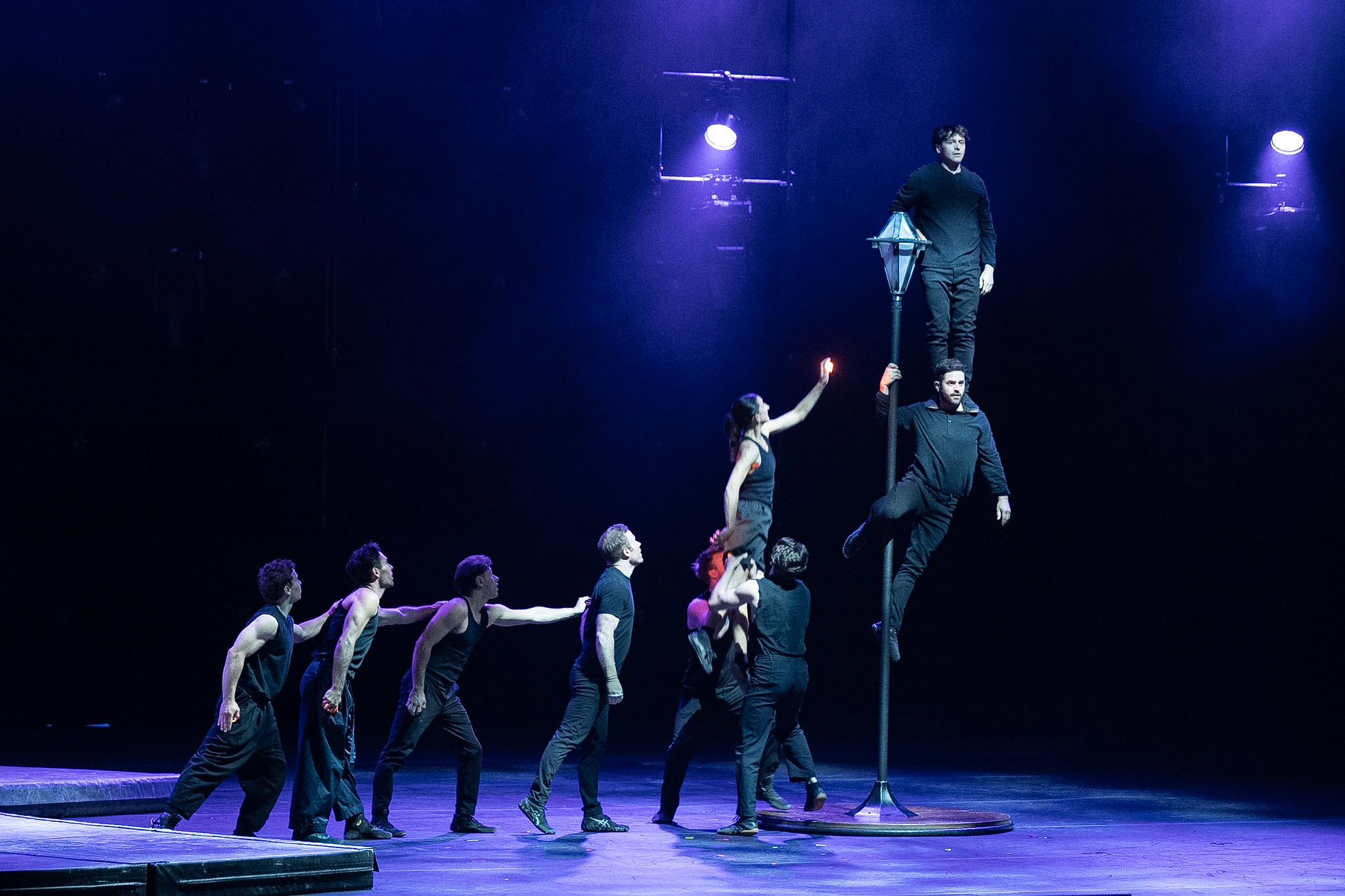 Nine people dressed in black performing onstage at the National Art Centre as part of the Governor General Performing Arts Awards show..
