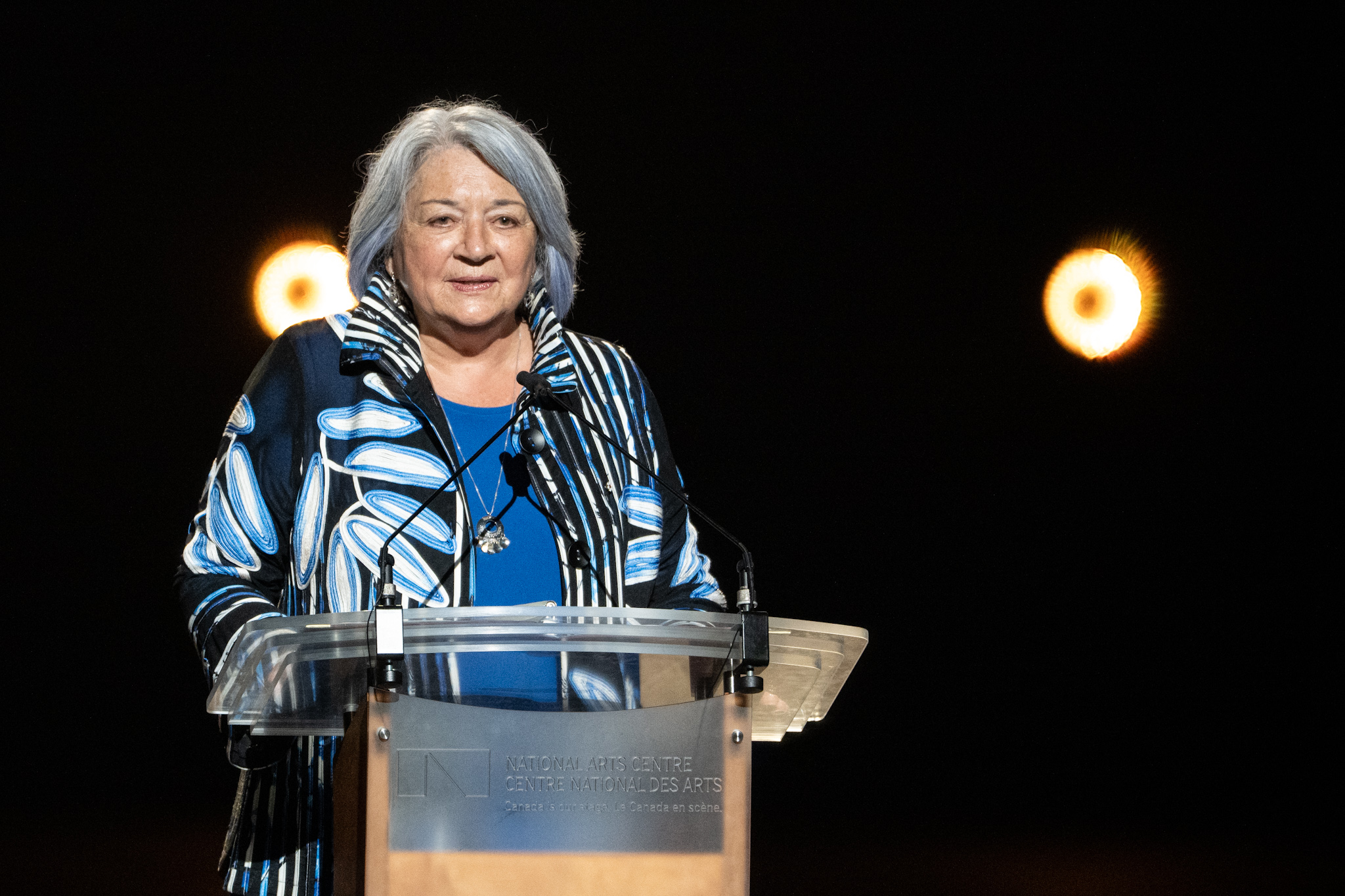 Governor General Mary Simon standing at the podium onstage at the National Arts Centre for the Governor General Performing Arts Awards.