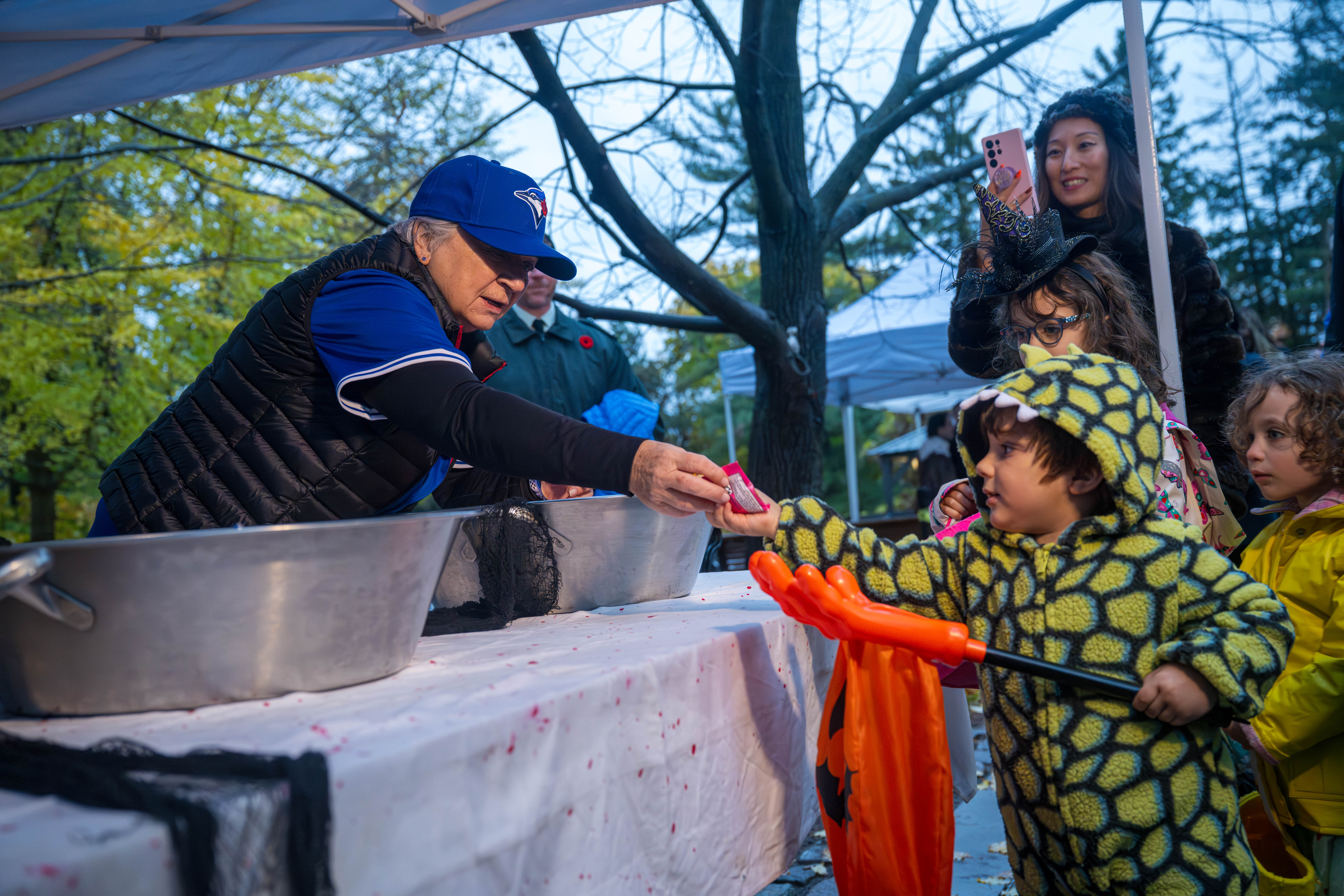 Governor General Mary Simon handing out Haloween candy.