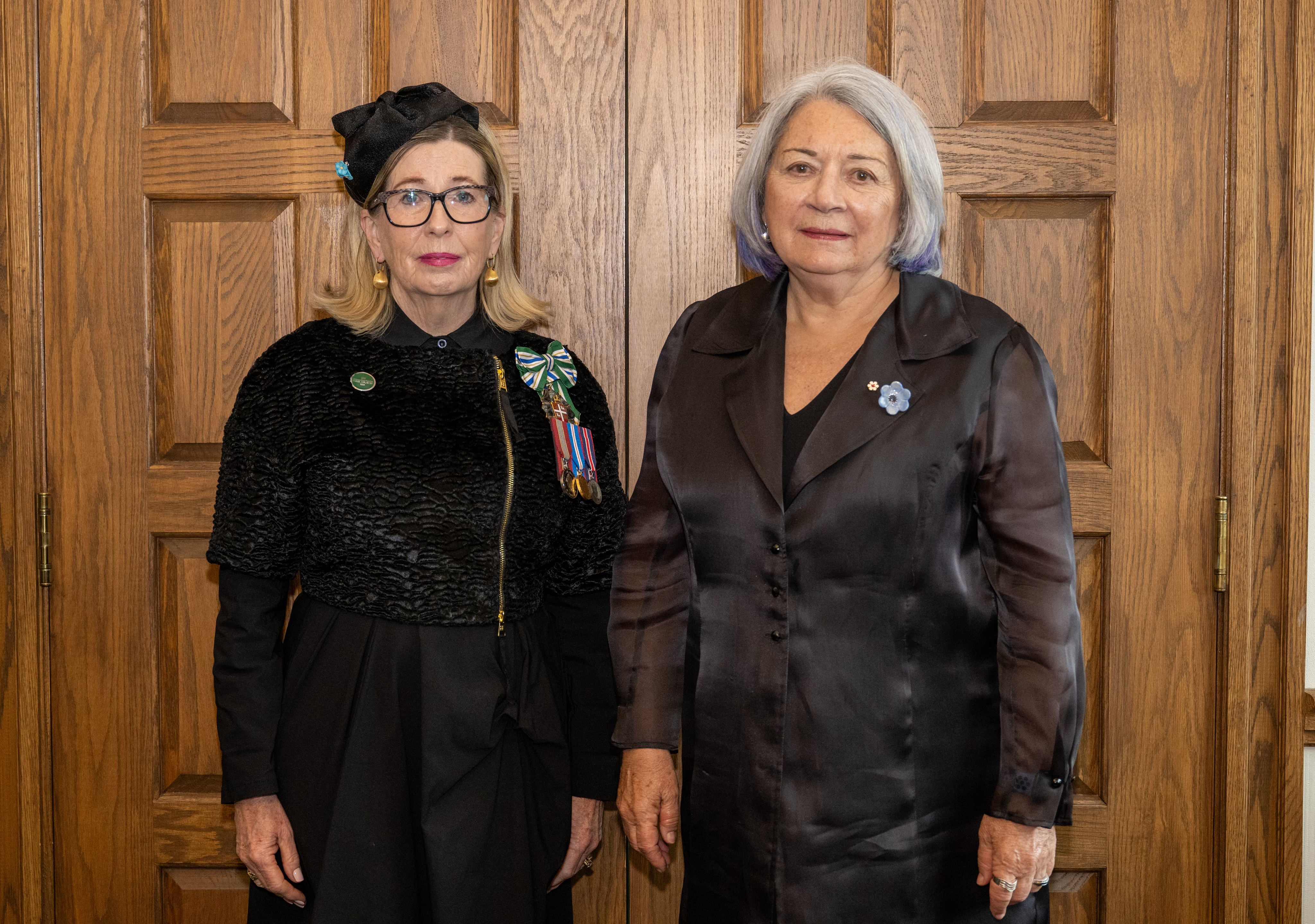 Governor General Simon standing next to Marie Aylward, Lieutenant-Governor of Newfoundland and Labrador. They are both dressed in black.