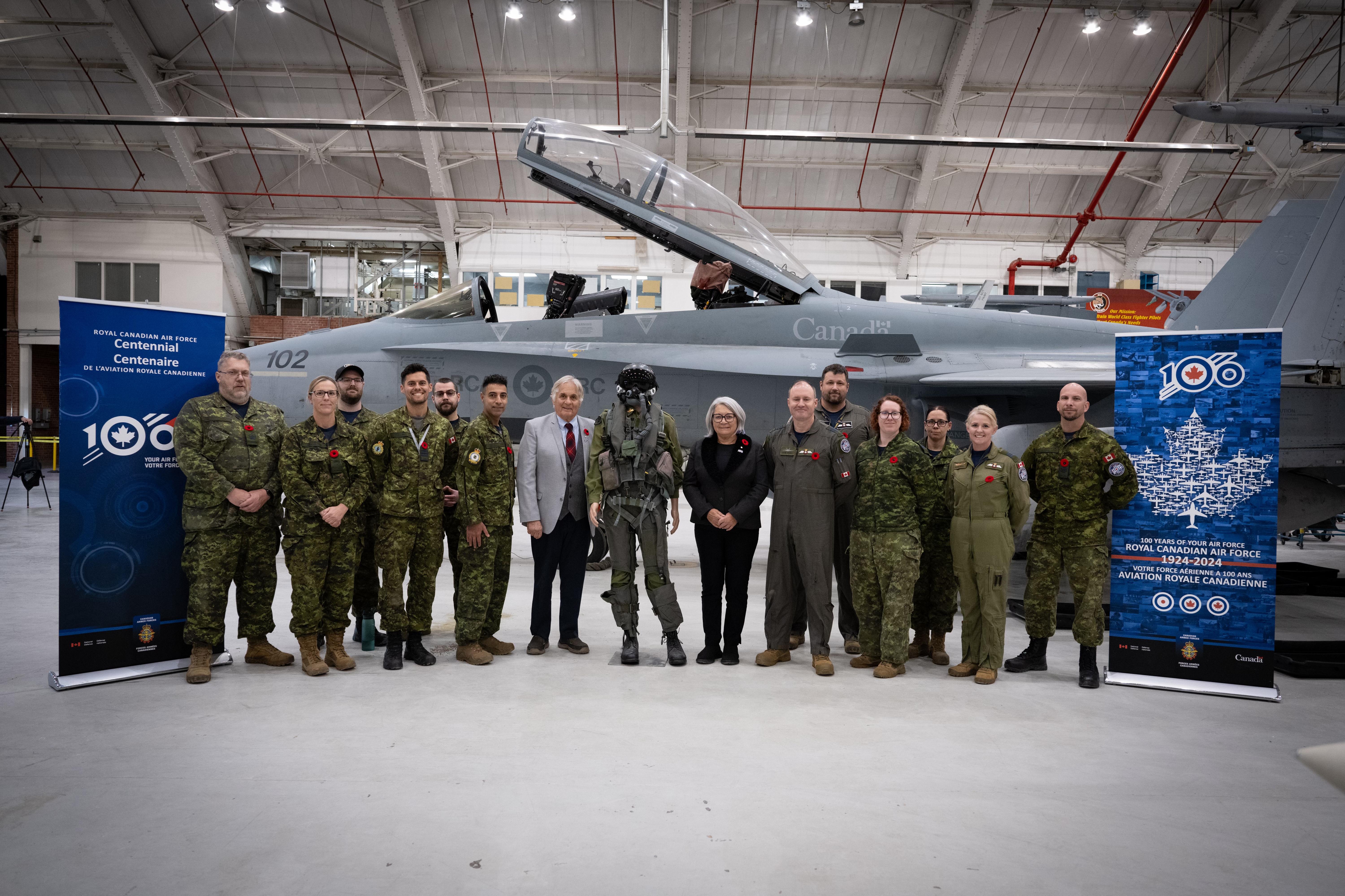 Governor General Mary Simon and Mr. Whit Fraser stand next to RCAF members.