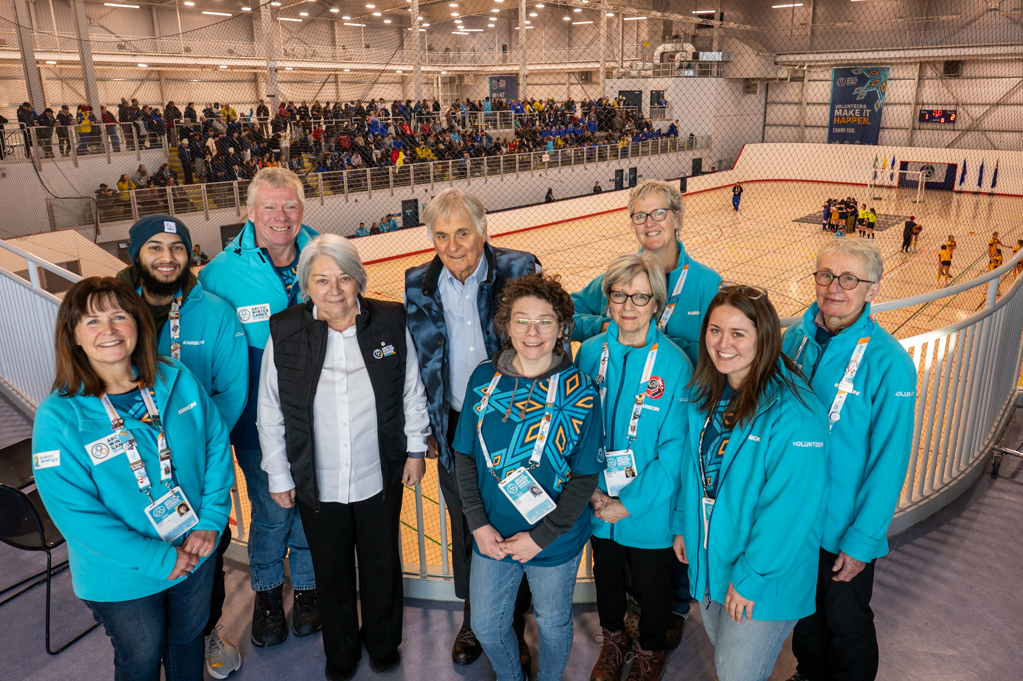 Governor General Mary Simon and Mr. Whit Fraser with a group of individuals at the Arctic Winter Games.