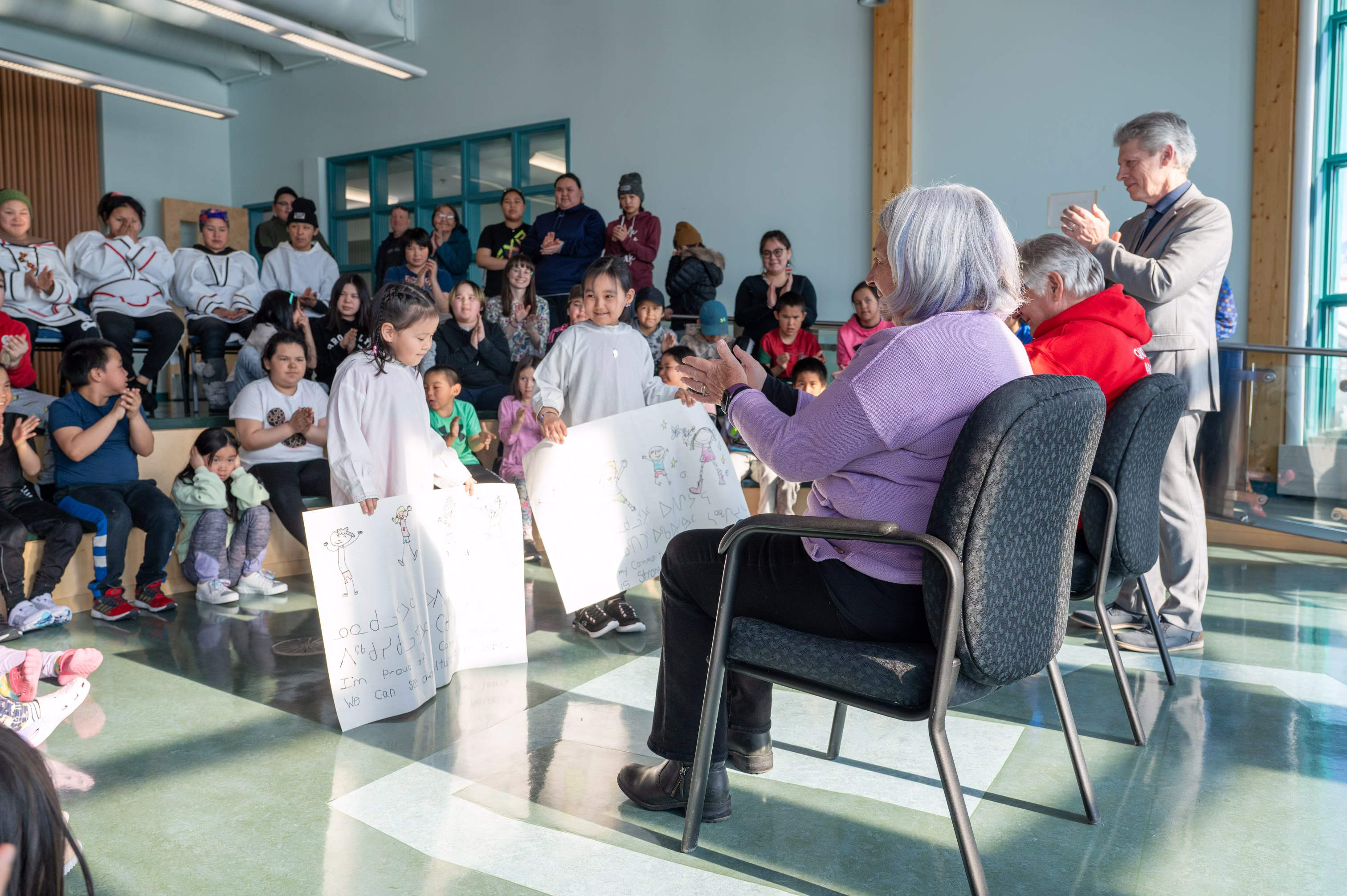 Governor General Mary Simon is presented with drawings by two young Inuit children