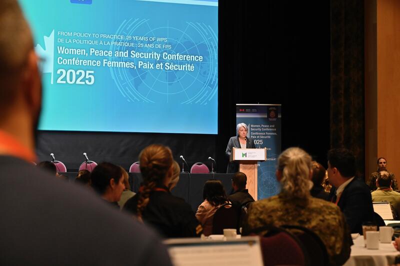 Governor General Mary Simon speaking in a large conference room.