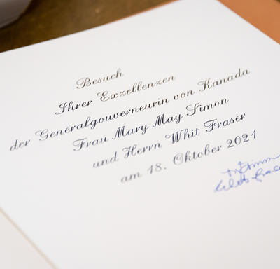 A photo of Their Excellencies signatures in a guest book.