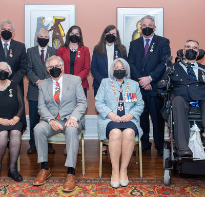 Recipients of the Sovereign's Medal for Volunteers posing with Their Excellencies.