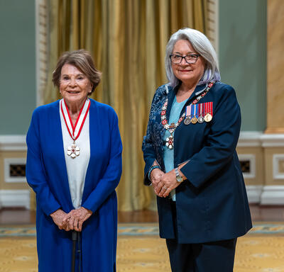 Janette Bertrand is standing next to the Governor General.