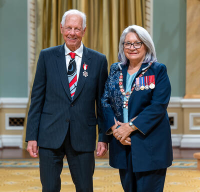 C. Michael O’Brian is standing next to the Governor General.