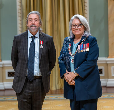 Louis Paquin is standing next to the Governor General.