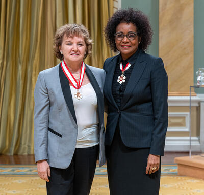 Eugenia Kumacheva is standing next to The Right Honourable Michaëlle Jean.
