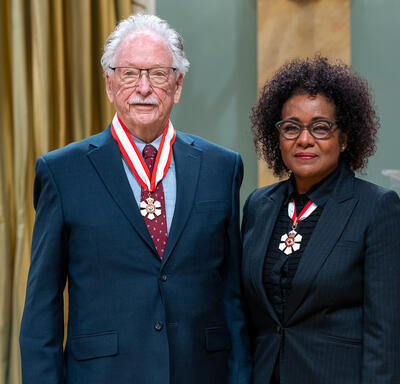 James V. Zidek is standing next to The Right Honourable Michaëlle Jean.