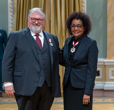 Paul Born is standing next to The Right Honourable Michaëlle Jean.