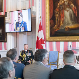 The Governor General delivers remarks at a podium.