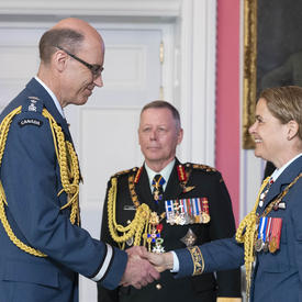 The Governor General shakes hands with Brigadier-General Andrew Michael Downes, O.M.M., C.D.