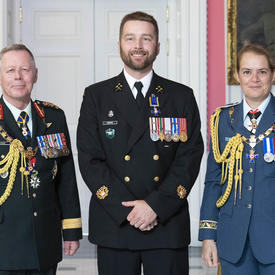 Chief of the Defence Staff of the Canadian Armed Forces General Jonathan Vance and the Governor General pose with  Chief Petty Officer 2nd Class Chesley Wayne Keeping, M.M.M., C.D.