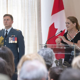 The Governor General delivers a speech at a podium.