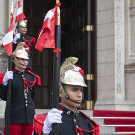 Guards welcomed the Governor General to the Peruvian presidential palace. 