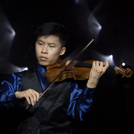 Canadian violinist, Kerson Leong, plays at a reception. 