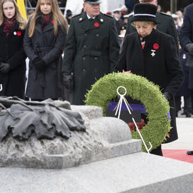 The Silver Cross Mother lays a wreath during the National Remembrance Day Ceremony. 