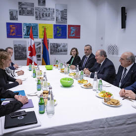 The Governor General met with President of the Republic of Armenia, Armen Sarkissian are sitting around a table with other government officials. 