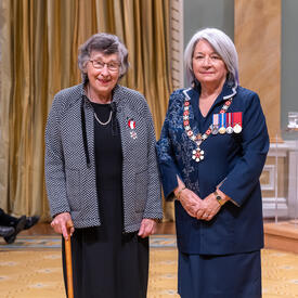 Sandra Djwa is standing next to the Governor General.