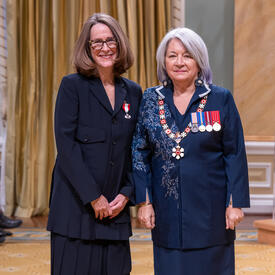 Sarah Fellowes Milroy is standing next to the Governor General.