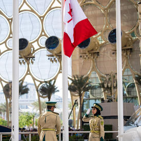The Canada flag being raised at Expo 2020 Dubai.