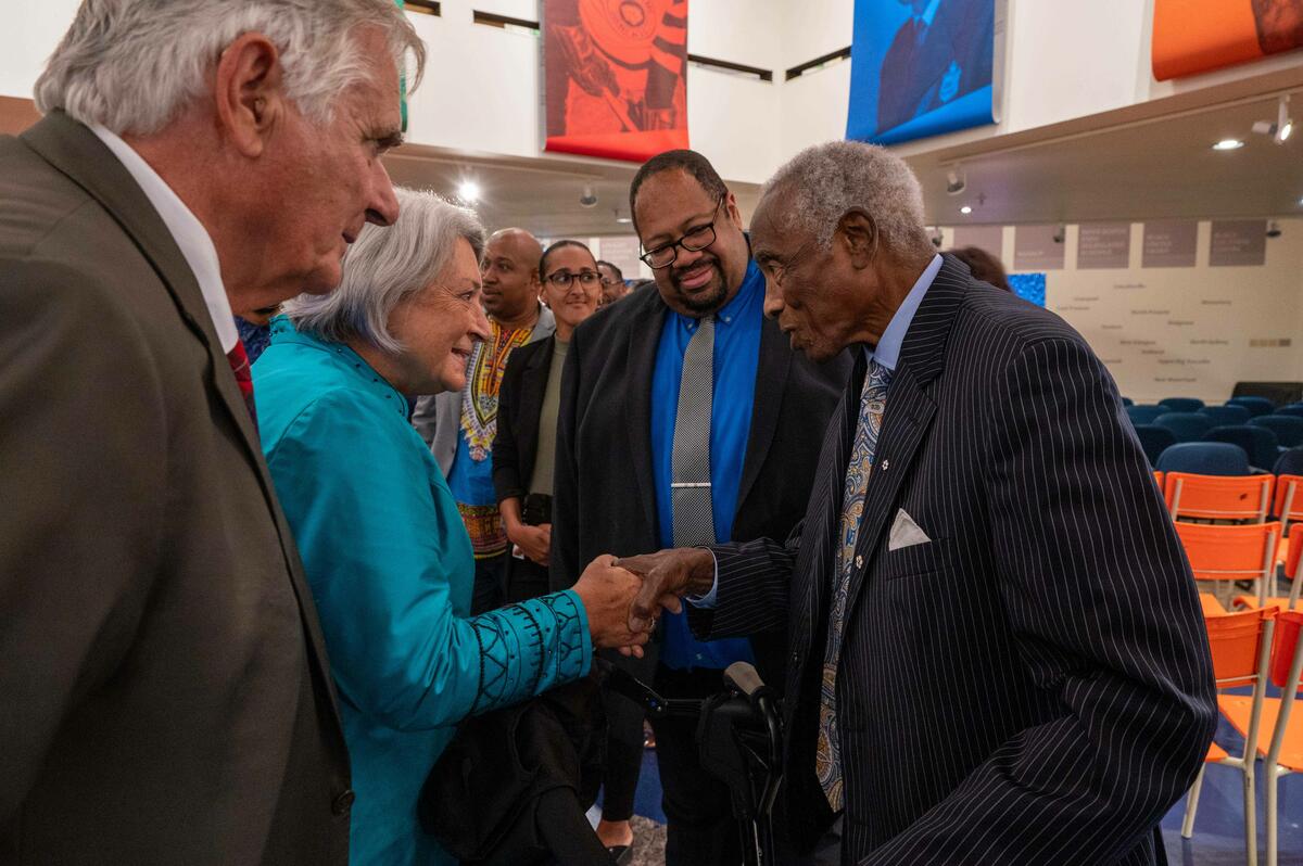 Governor General Mary Simon shakes hands with a participant