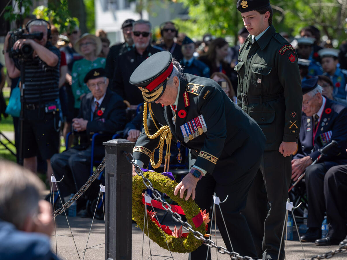 Governor General Mary Simon lays a wreath during the ceremony. She is dressed in the Canadian Army Uniform