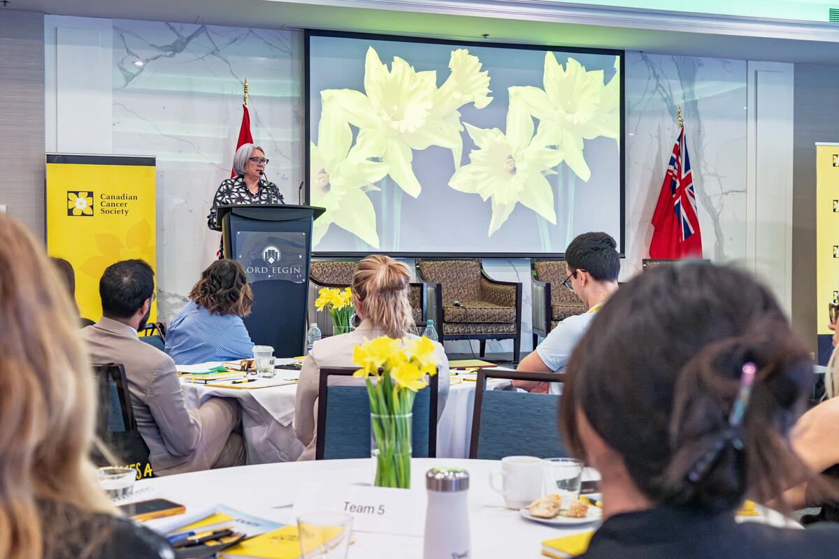 Governor General Mary Simon standing at a podium at the Canadian Cancer Society Summit.
