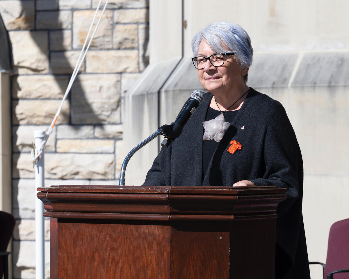 Governor General Mary Simon standing at an outdoor podium. 