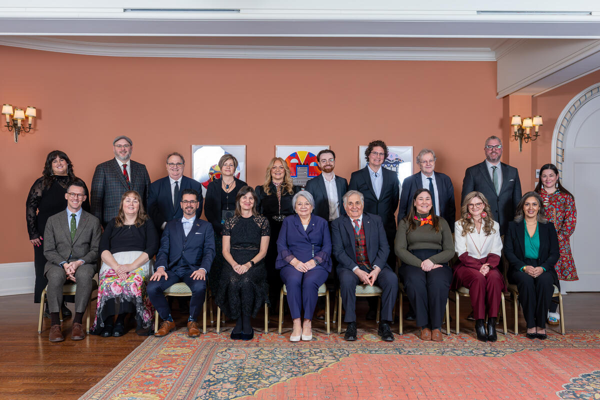 Governor General Mary Simon and Mr. Whit Fraser posing with Governor General History Awards recipients.
