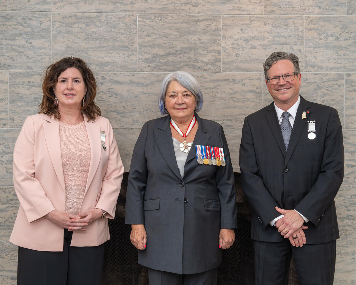 Governor General Mary Simon with two Polar Medal recipients.