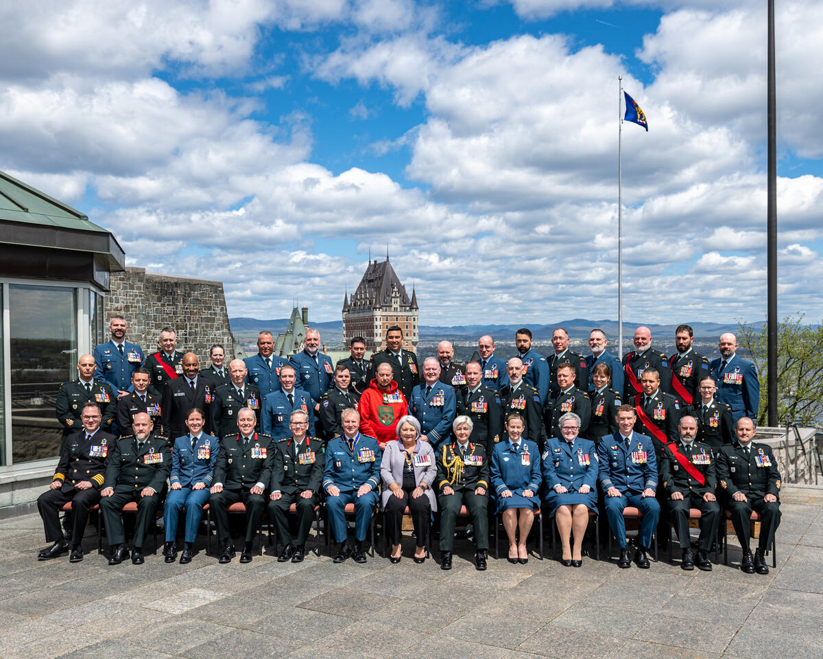 Governor General Mary Simon with Order of Military Merit recipients. They are outside of the Citadelle.