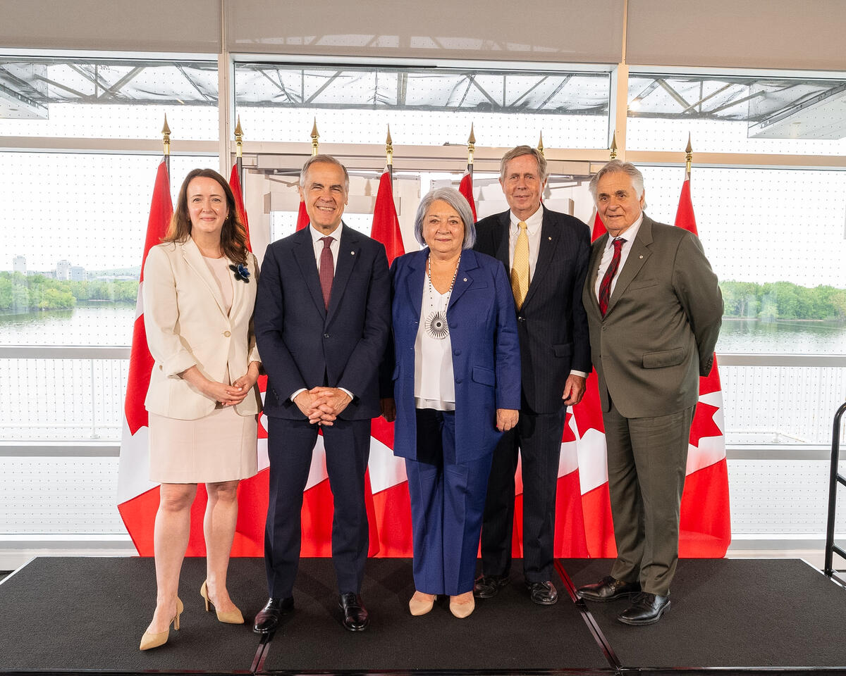 Members of the Rideau Hall Foundation standing with Prime Minister Mark Carney, Governor General Mary Simon and Mr. Whit Fraser. 