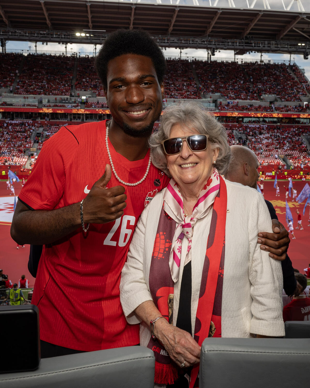 Governor General Arbour with her guest, a student from Louise Arbour Secondary School. The student is giving a thumbs up.