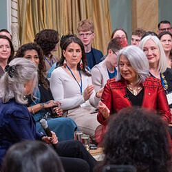 Governor General Mary Simon speaks with Lisa LaFlamme sitting in chairs in the Ballroom