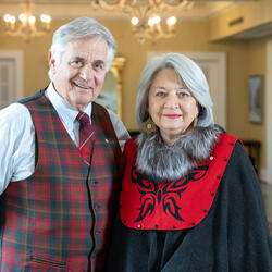 Mr. Whit Fraser and Governor General Mary Simon are standing in the Long Gallery at Rideau Hall.