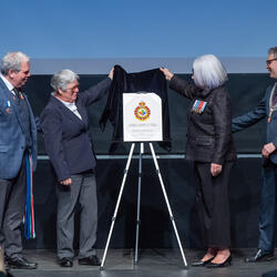 Governor General Mary Simon unveils the new Rainbow Veterans of Canada badge on stage