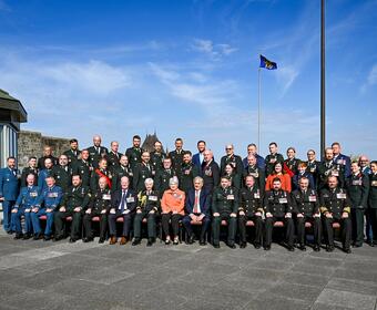 Governor General Mary Simon and Mr. Whit Fraser posing for a photo with honours recipients outside of the Citadelle.